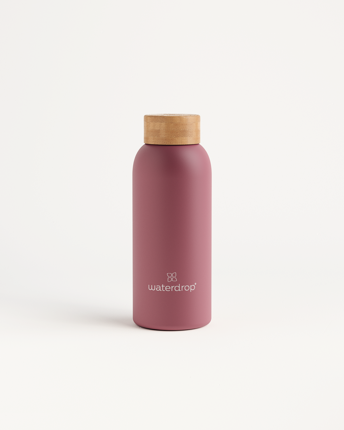 Thermo Steel bottle with a cork top and pink wooden cap, designed to keep drinks cold for 24 hours or hot for 12 hours.